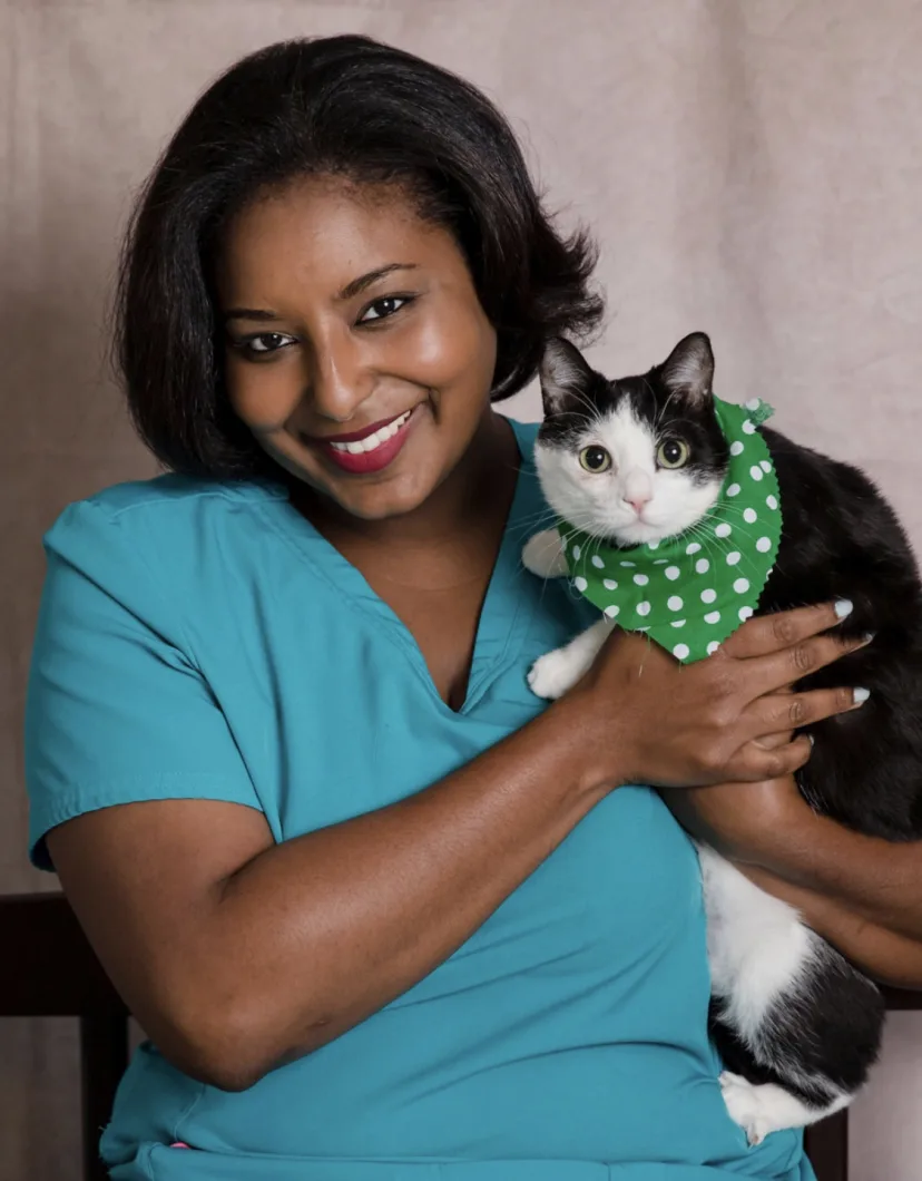 Lindsey Gaines of Animal Health Center of Madison holding black and white cat